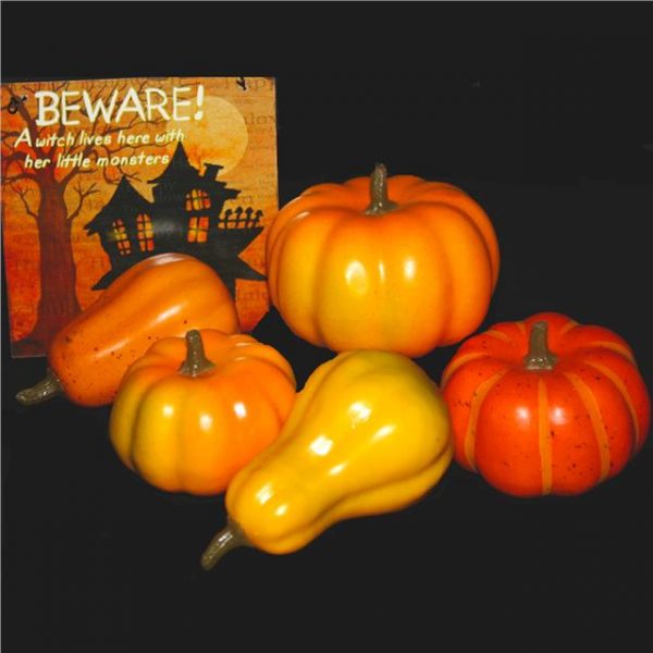 five small fake plastic pumpkins
