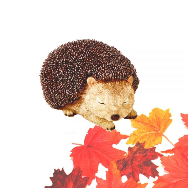 cute hedgehog ornament with artificial maple leaves