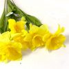 bundle of artificial yellow daffodils