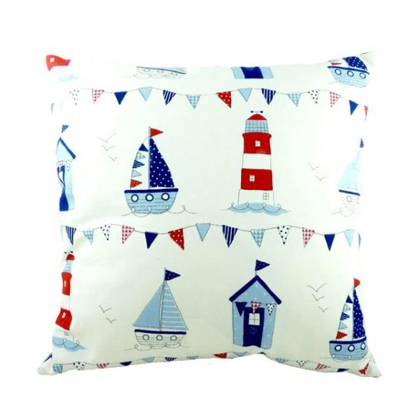nautical cushion with blue and red boats, beach huts and lighthouses