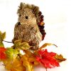 glittery wooden hedgehog ornament with artificial leaves