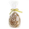 pine cone candle wrapped in decorative packaging