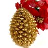 large gold pine cone candle