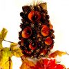 pine cone wooden hedgehog ornament with artificial leaves