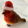 robin Christmas ornament with attached Santa hat