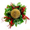 mistletoe candle ring with red ribbon and pine cone candle