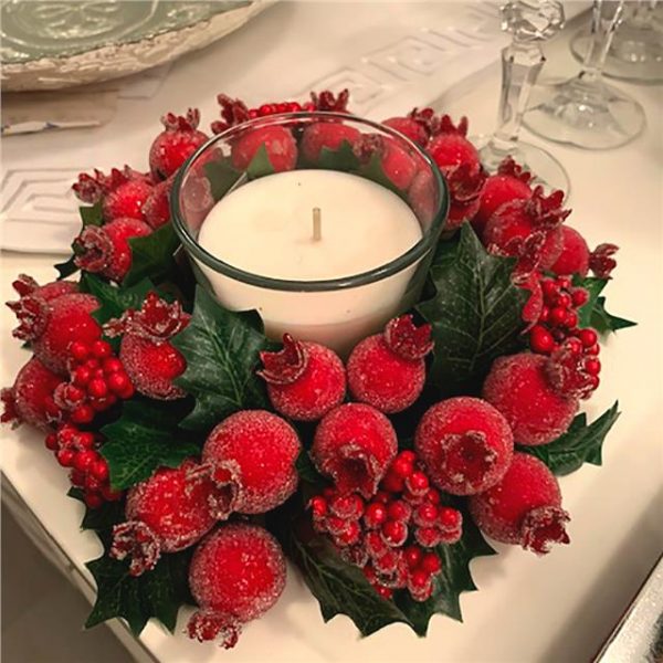 Christmas Candle Ring with green holly red berries and red frosted fruit.