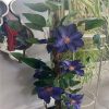 https://shared1.ad-lister.co.uk/UserImages/7eb3717d-facc-4913-a2f0-28552d58320f/Img/artificialpo/Purple-Flower-Clematis-Plant-with-ceramic-pot.jpg