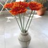 https://shared1.ad-lister.co.uk/UserImages/7eb3717d-facc-4913-a2f0-28552d58320f/Img/artificialfl/Artificial-Sungle-Orange-Gerbera-Flower-Stem.jpg